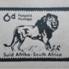 wooden postage stamp of lion