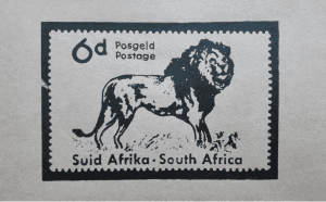 wooden postage stamp of lion